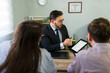 © AntonioDiaz - Lawyer advising couple completing visa application process