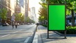 © ShareAboutThings - Blank green screen billboard for advertising mockup on a sunny urban city street sidewalk with blurred background