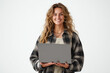 © Saifullah - a happy young woman holding a laptop computer, isolated on a white background
