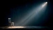 © horizon - Single, empty chair rests on a wooden stage, illuminated by a solitary, dramatic spotlight from above. Visible light beams cut through the dark room.