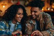 © Markus Schröder - Portrait of a happy multiethnic couple in their 20s playing a board game