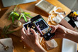 © Marko Geber - Young adult woman photographing jewelry with smartphone