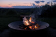 © Yuriy T - round circle fire pit burning logs at sunset in catskills mountains catskill upstate new york travel camping leisure scenic nature landscape flame wood wooden log warmth cozy outdoor adventure