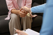© New Africa - Professional psychologist supporting patient during therapy in office, closeup