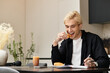© Bliss - Young man enjoys a delightful breakfast in a stylish apartment filled with natural light