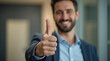 © Lednev - Positive customer showing thumb up in approval.