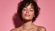 © LimeSky - Attractive woman with radiant skin smiling with closed eyes in front of a pink backdrop