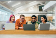 © oneinchpunch - young programmers working on a new project for a start up business.