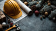 © syhin_stas - Christmas decorations, gifts, fir branches, blueprint, measuring tool and hard hat lying on a gray surface, celebrating christmas holidays in the architecture and construction industry