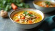 © Maryna - Protein-rich chicken soup with vegetables served in a stylish bowl. Warm, nourishing broth with shredded chicken, carrots, and parsley. Delicious homemade culinary meal, perfect for lunch or dinner.