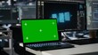 © DC Studio - Close up of isolated screen laptop in data center used by programmer managing AI systems for uptime and efficiency. Admin using artificial intelligence tech on mockup notebook in server hub, camera A