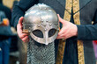 © Nano - A medieval warrior's helmet shown from the hands. A highly detailed metal helmet with its chainmail and very well maintained. A medieval warrior's helmeted hands.