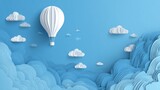 White clouds and hot air balloon in blue sky background