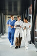 © LIGHTFIELD STUDIOS - Dedicated medical professionals collaborate in a vibrant modern hospital setting