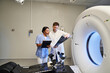© LIGHTFIELD STUDIOS - Doctors collaborate on MRI scan interpretation in a state-of-the-art hospital