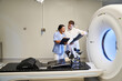 © LIGHTFIELD STUDIOS - Doctors collaborate on MRI evaluation in a state-of-the-art healthcare facility