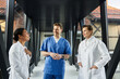 © LIGHTFIELD STUDIOS - Collaboration among diverse medical professionals in a contemporary hospital setting