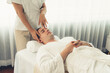 © InfiniteFlow - Caucasian man enjoying relaxing anti-stress head massage and pampering facial beauty skin recreation leisure in dayspa modern light ambient at luxury resort or hotel spa salon. Quiescent
