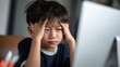 © Oleksandr - Child Computer Headache. Asian Schoolboy in Pain from Exam. Student Sad Facial Expression