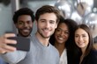 © Regina Gafarova - Group of diverse employees smiling and taking fun selfies together at a company celebration, surrounded by festive balloons and a cheerful atmosphere
