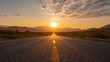 © AkuAku - Sunset view of a mountain landscape with an asphalt road
