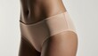© Teerapat - Close-Up Side View of Woman's Hip in Smooth Underwear Fabric