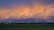 © AIArtistry - Wide-angle shot of a sky painted with sunset hues along a weather front boundary