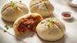 © vxnaghiyev - Chinese steamed pork buns with BBQ filling