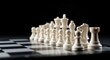 © andi - White chess pieces arranged on a board against a black background