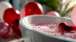 © Aliaksandra - Heart-shaped decoration floating in pink bubble bath surrounded by balloons, symbolizing relaxation and love