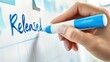© vectcore - A hand holding a blue marker and writing the word released on a whiteboard with a faint graph and sticky notes, signifying the completion of a project or product launch