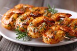 Grilled seasoned crustaceans presented on skewers resting on a white dish