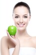 © Konstiantyn Zapylaie - Smiling young caucasian female holding fresh green apple on white background