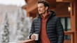 © World of AI - Man in a black puffer jacket and rust-colored sweater stands on a balcony, holding a coffee cup, surrounded by a snowy landscape, enjoying a serene winter moment