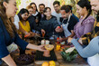 © Marcos - Group of Latin American Adult Students With Teacher Preparing recipe ingredients in Cookery Class in Mexico. Hispanic people multi generations learning together to cook in a terrace outdoors