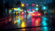 © Thiago - Raindrops create a blurry effect on a city street at night, with traffic lights visible