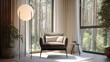 © Jinhao - a modern floor lamp with a black metal frame and round shade stands beside an armchair in front of large windows overlooking the forest outside. the room has neutral tones with soft lighting