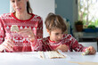 © Arianne - Mother and son baking christmas treats in kitchen