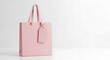 © Subrata - Pale Pink Shopping Bag with Blank Tag on White Surface gift