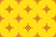 © noppachai - Bright folk diamond geometric pattern in yellow and red tones. Inspired by traditional ethnic art with a modern twist, perfect for textile design, fabric prints, wallpapers, and cultural decorative pr