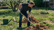 © AnnaFocusArt - Man digging a hole in the garden for a new tree