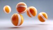 © Nataliia_Trushchenko - Four orange and white balls are flying through the air. The balls are orange and white striped and appear to be bouncing off each other. The scene has a playful and energetic mood