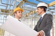 © BillionPhotos.com - Construction Engineering worker discusses plan the building