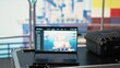 © DC Studio - Laptop on drilling barge displaying predictive maintenance dashboard, monitoring machinery. Notebook on offshore platform deck digital analyzing performance metrics, zoom in shot