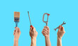 © New Africa - People holding different tools in hands against light blue background, closeup. Collage