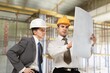 © BillionPhotos.com - Team of engineer construction inspecting building