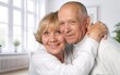 © BillionPhotos.com - Hug, love of senior couple relaxing together at home.