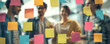 © Hathairat - Colorful sticky note brainstorming session with colleagues collaborating on project planning and creative ideas