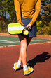 © Cavan Images - Woman playing pickleball in autumn
