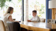 © Pavel - A young boy is engaging in an insightful discussion with an adult in a modern workspace environment